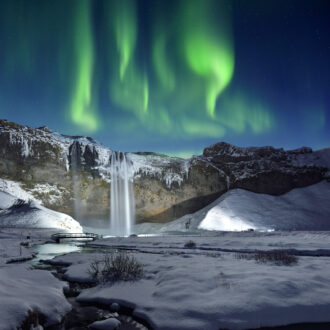 Skogafoss Waterfall and Green Aurora, Iceland