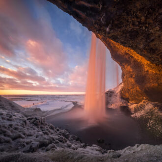 Colorful,Sunset,In,Cave,Behind,Seljalandsfoss,Waterfall,In,Winter,,Iceland